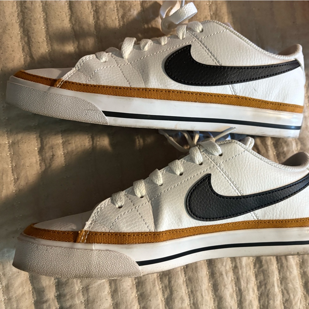 Nike womens White Sneakers with Gold and Black Accents court legacy
